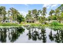 Lakefront home with private dock and lush trees at 16837 Arrowhead Blvd, Winter Garden, FL 34787