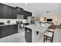 Modern kitchen with stainless steel appliances and granite countertops at 1616 Carey Palm Cir, Kissimmee, FL 34747