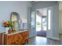 Entryway with a mid century modern console table at 13978 Lanyard Way, Winter Garden, FL 34787