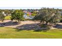 Community view showcasing a clubhouse and golf course at 7487 Gathering Dr, Reunion, FL 34747