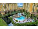Aerial view of resort community with pirate ship-themed pool and multiple buildings at 8100 Poinciana Blvd # 2203, Orlando, FL 32821