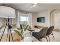 Bright living room with comfortable seating and sliding doors to balcony at 545 Ocean Course Ave # 545, Davenport, FL 33896