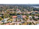 Aerial view of a luxury home with a large backyard and swimming pool at 9217 Hidden Bay Ln, Orlando, FL 32819