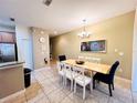 Bright dining room with a large table and six chairs at 8953 California Palm Rd, Kissimmee, FL 34747