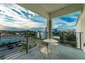 Balcony with small table and chairs overlooking the community at 3111 Paradox Cir # 406, Kissimmee, FL 34746