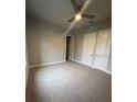 Spacious bedroom with carpeted floor and ceiling fan at 7760 Sandy Ridge Dr # 119, Kissimmee, FL 34747