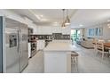 Modern kitchen with stainless steel appliances and an island at 4741 Clock Tower Dr # 208, Kissimmee, FL 34746