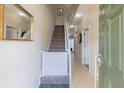 Bright and spacious entryway with staircase and storage at 2433 Caravelle Cir, Kissimmee, FL 34746