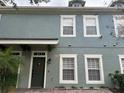 Two-story townhome with a brick paver driveway at 2433 Caravelle Cir, Kissimmee, FL 34746