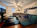 L-shaped sectional and large TV in this living area at 2554 Yale Rd, South Daytona, FL 32119