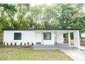 Newly renovated white house with carport at 635 Maitland Ave, Altamonte Springs, FL 32701