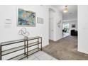 Bright and spacious entryway with glass console table at 320 Ballo Dr, Kissimmee, FL 34746