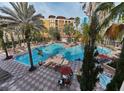 Resort pool with a hot tub and plenty of space for relaxation at 12538 Floridays Resort Dr # 401-C, Orlando, FL 32821