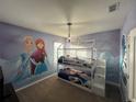 bedroom with bunk bed and Frozen themed mural at 4425 Durga Ln, Kissimmee, FL 34746