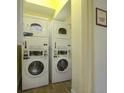 On-site laundry room with two sets of washer and dryer at 3000 Maingate Ln # 522, Kissimmee, FL 34747