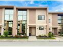 Modern townhome with large windows and stone accents at 3114 Rockefeller Way, Kissimmee, FL 34747
