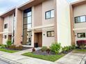 Modern townhome with large windows and stone accents at 3114 Rockefeller Way, Kissimmee, FL 34747
