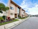 Modern townhome community with lush landscaping at 3114 Rockefeller Way, Kissimmee, FL 34747