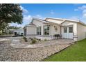 Well-maintained one-story house with a paved walkway and attractive landscaping at 9076 Sw 95Th Ave # 9076, Ocala, FL 34481