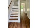 Bright entryway with staircase and view to backyard at 1856 Emily Dr, Winter Haven, FL 33884