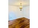 Spacious dining room with hardwood floors and chandelier at 1856 Emily Dr, Winter Haven, FL 33884