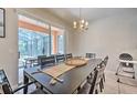 Bright dining room featuring a large table with seating for eight and access to a screened patio at 742 Orange Cosmos Blvd, Davenport, FL 33837