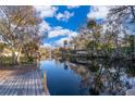 Relaxing waterfront view with a wooden dock and calm water at 55746 Carroll St, Astor, FL 32102