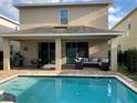 Relaxing pool and patio area, perfect for entertaining at 7405 Marker Ave, Kissimmee, FL 34747