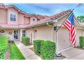 Townhouse entry with walkway and landscaping at 28 Golf Villa Dr, Port Orange, FL 32128