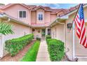 Townhouse entry with walkway and landscaping at 28 Golf Villa Dr, Port Orange, FL 32128