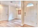Bright entryway with light wood flooring at 28 Golf Villa Dr, Port Orange, FL 32128