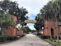 Community entrance with signature archway at 750 E Michigan St # 163, Orlando, FL 32806
