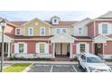 Two-story townhouses with inviting front porches and landscaping at 7529 Sunflower Cir, Kissimmee, FL 34747