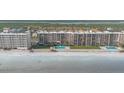 Aerial view of beachfront condo building with pool and ocean views at 4445 S Atlantic Ave # 606, Ponce Inlet, FL 32127
