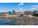 Lakefront property with a large house, pool, and private dock at 4200 Down Point Ln, Windermere, FL 34786
