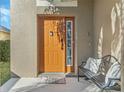 Inviting front door entrance with a bench and welcome mat at 2881 Kokomo Loop, Haines City, FL 33844