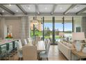 Open concept dining area with lake view and modern light fixture at 4174 Grande Brick Loop # 25, Orlando, FL 32837