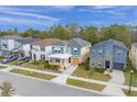 Row of new construction homes with tree-lined street at 1909 Tropical Palms Cir, Kissimmee, FL 34747