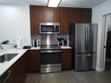 Modern kitchen with stainless steel appliances at 14501 Grove Resort Ave # 2211, Winter Garden, FL 34787