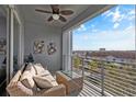 Relaxing balcony with outdoor furniture and city views at 4751 Clock Tower Dr # 402, Kissimmee, FL 34746