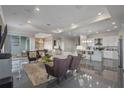 Open living room with modern kitchen and high ceilings at 4751 Clock Tower Dr # 402, Kissimmee, FL 34746