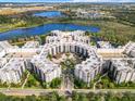 Large condominium complex with a central courtyard and water features at 14501 Grove Resort Ave # 3327, Winter Garden, FL 34787