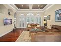 Spacious living room with hardwood floors and comfortable seating at 6443 Cartmel Ln, Windermere, FL 34786