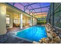 Inviting pool area with covered patio and spa at 6443 Cartmel Ln, Windermere, FL 34786