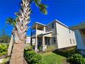 Two-story house with balcony and palm trees in front at 728 Costa Ln, Debary, FL 32713