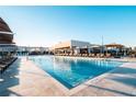 Resort-style pool with plenty of lounge chairs at 3062 Rockefeller Way, Kissimmee, FL 34747