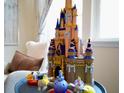 Disney castle figurine displayed in the living room at 14563 Orchid Island Dr, Orlando, FL 32827