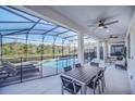 Covered patio with pool, spa, and outdoor seating at 6115 High Seas Dr, Orlando, FL 32821