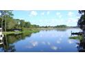 Tranquil lake view from the property, ideal for relaxing or watersports at 1333 N Fowler Dr, Deltona, FL 32725