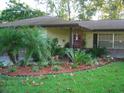 House exterior showcasing a well-maintained front entrance with lush landscaping at 1333 N Fowler Dr, Deltona, FL 32725